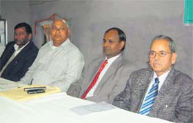 Udit Raj, All-India Confederation of the SC/ST Organisations president (in red tie), addresses a convention in Dehradun