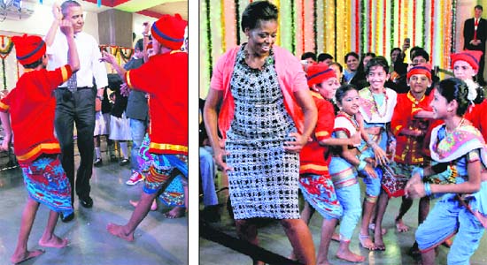 DESI BEATS: President Obama and First Lady Michelle shake a leg with school students during Divali celebrations in Mumbai on Sunday