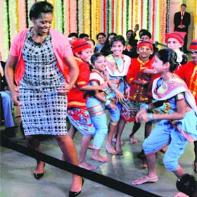 DESI BEATS: First Lady Michelle Obama shakes a leg with school students during Divali celebrations in Mumbai on Sunday