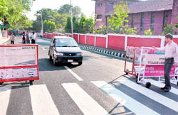 Barricades put up by the police on a road leading to the Civil Secretariat