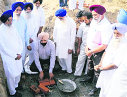 Zila Parishad chairman Manpreet Ayali lays the foundation stone of the Mata Gujri Memorial Library and Education Society at Bhanohar village