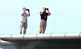 Secret Service personnel keep a watch during US President Barack Obama and First Lady Michelle Obamas arrival in New Delhi on Sunday. 