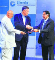 Andhra Pradesh Chief Minister K Rosaiah with Tata Group Chairman Ratan Tata (R) at the inauguration of the first Sikorsky S-92 helicopter cabin made in India by Tata Advance Systems, in Hyderabad on Sunday.
