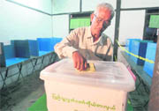A man casts his ballot at a polling station in Sittwe on Sunday