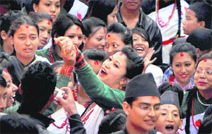 CELEBRATING THE NEW YEAR: Girls from Nepals ethnic Newar community participate in a parade to celebrate New Year or Nepal Sambat in Kathmandu on Sunday. Nepal Sambat is celebrated during Tihar, or festival of lights, one of the second biggest Hindu festivals of Nepal. 