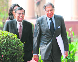 Industrialists Mukesh Ambani and Ratan Tata arrive to attend a joint press conference by US President Barack Obama in New Delhi on Monday. 