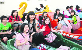 Students and teachers from Yishun Secondary School, Singapore, who are on a study exchange programme, have fun at Sukhna Lake in Chandigarh