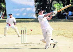 A batsman attempts an ambitious shot with his eyes closed at the Chaudhary Charan Singh Memorial T20 Cricket Tournament in Dehradun