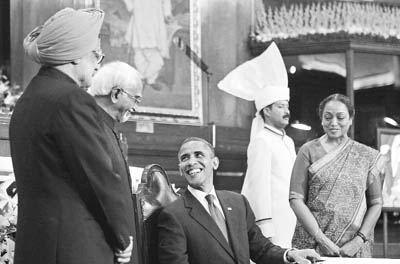 US President Barack Obama shares a laugh with Prime Minister Manmohan Singh, Vice-President Hamid Ansari and Lok Sabha Speaker Meira Kumar at the Parliament House in New Delhi on Monday.
