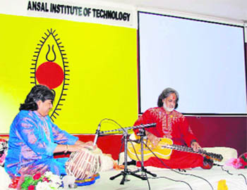 Renowned Indian musician Vishwa Mohan Bhatt Ansal performs on a Mohan Veena during a live concert organised by the Ansal Institute of Technology (AIT), Gurgaon, in Association with SPIC MACAY. 