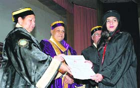 HP Governor Urmila Singh and Chief Minister P K Dhumal award a degree of Ph.D to a student in HPU, Shimla