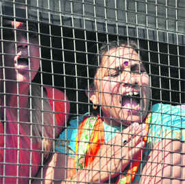 Workers of the Jammu and Kashmir BJP after their arrest raise slogans against Chief Minister Omar Abdullah in Jammu on Monday.