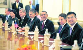 US President Barack Obama with members of his delegation during a bilateral meeting with Prime Minister Manmohan Singh in New Delhi