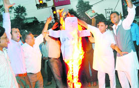 Members of the Swadeshi Jagaran Manch burn an effigy of US President Barack Obama, in Jalandhar on Monday