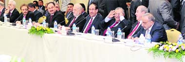 Iraqi leaders attend a meeting in Arbil on Monday