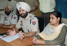 SSP Sukhchain Singh Gill presents the girl rescued from kidnappers before the media in Bathinda on Tuesday