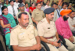 Police officials and residents attend a panel discussion organised by the Chandigarh Police and the Rotary International in Sector 31, Chandigarh, on Monday