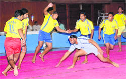 Kabaddi players in action during the Panjab University Inter-College Kabaddi (NS) Men-B-Division Tournament at the PU Gymnasium Hall in Chandigarh on Tuesday.