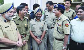 Outgoing police commissioner Y.S. Dadwal shares a light moment with his colleagues at his farewell party in New Delhi