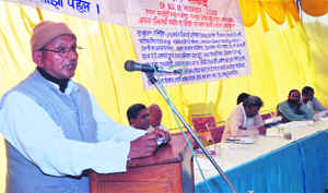 Bihari Lal, Chairman of the Lok Jeewan Vikas Bharati, addresses a seminar in Dehradun on Tuesday.