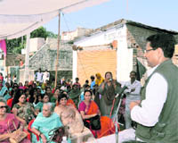 Surya Kant Dhasmana, Congress leader, addresses a convention in Dehradun on Monday.