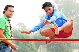 A participant in the high-jump competition during the three-day primary sports and cultural meet at Karna Stadium in Karnal