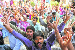 Members of the Civic Safai Karamchari Union celebrate after the acceptance of their demands by the state government in Jammu on Tuesday.