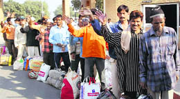 Pakistan nationals await their turn to cross over to their country at the 