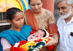 The newborn baby girl found in the Panghura at the MGD School for Deaf and Dumb in Bathinda with Red Cross officials on Wednesday