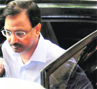 Satyam Computers former chairman B Ramalinga Raju arrives to surrender before a trial court at Nampally in Hyderabad on Wednesday.