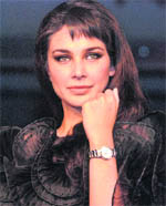 Actress and Rado brand ambassador Lisa Ray displays a watch from the new Rado Centrix collection during  its launch in New Delhi 