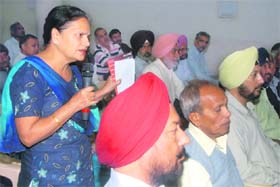 A woman airs her views during a Residents Welfare Association meeting in Chandigarh