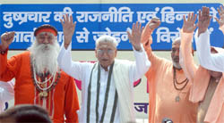 Ashok Singhal, president of the Vishwa Hindu Parishad, with sadhus take part in a protest rally organised by the RSS against the alleged attempts to defame the organisation at Jantar Mantar in New Delhi 