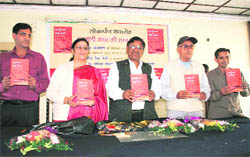 Singer Narender Singh Negi releases the first Garhwali dictionary in Dehradun on Wednesday.