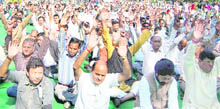 RSS workers stage a dharna at the Gandhi Park in Dehradun on Wednesday.