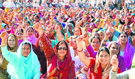 RSS activists hold a protest in Dharamsala on Wednesday.