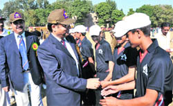 DGP Kuldeep Khoda being introduced to cricketers during the inaugural ceremony of the Police Promotional Cricket Cup for police martyrs kin and schoolchildren in Jammu on Wednesday. 