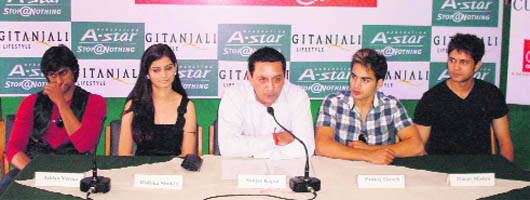 Sanjay Kapur (middle) with his team