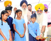 Education Minister Sewa Singh Sekhwan, Punjab MLA Ujjagar Singh Wadali launching Govt Edustar Adarsh School at Kalewal village by lighting the lamp in Mohali