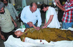 An injured Sarabjit Kaur of Nehianwala village under treatment at the Civil Hospital in Bathinda 