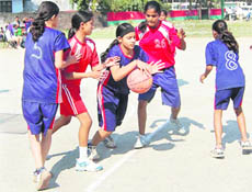 Players in action at the State-Level Basketball Championship in Dehradun on Thursday.