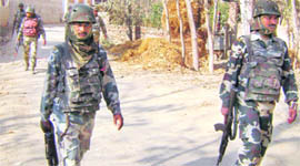 Security personnel patrol a street at Pattan in Baramulla where two CRPF personnel were killed by militants on Wednesday.