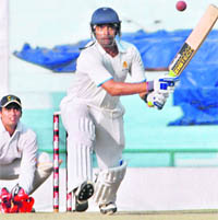 Robin Uthappa plays a reverse sweep on Thursday.