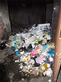 Heaps of garbage lie inside a shop in the Nehru Shopping Complex in Amritsar