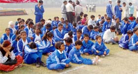 Visually-challenged children wait for the chief guest to arrive for the all-India sports competitions at Khalsa College in Amritsar