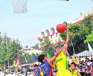 Students of St Xaviers Senior Secondary School in action during a basketball match in Chandigarh on Friday.