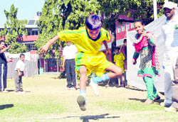 Special children participate in the long jump competition of the Special Olympics in Dehradun on Friday