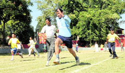 Special children participate in the long jump competition of the Special Olympics in Dehradun on Friday
