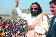 Sri Sri Ravi Shankar waves at the students at Lovely Professional University in Phagwara on Friday
