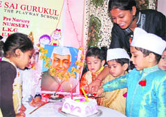 Students of Sai Gurukul cut a cake to celebrate Childrens Day in Jammu 